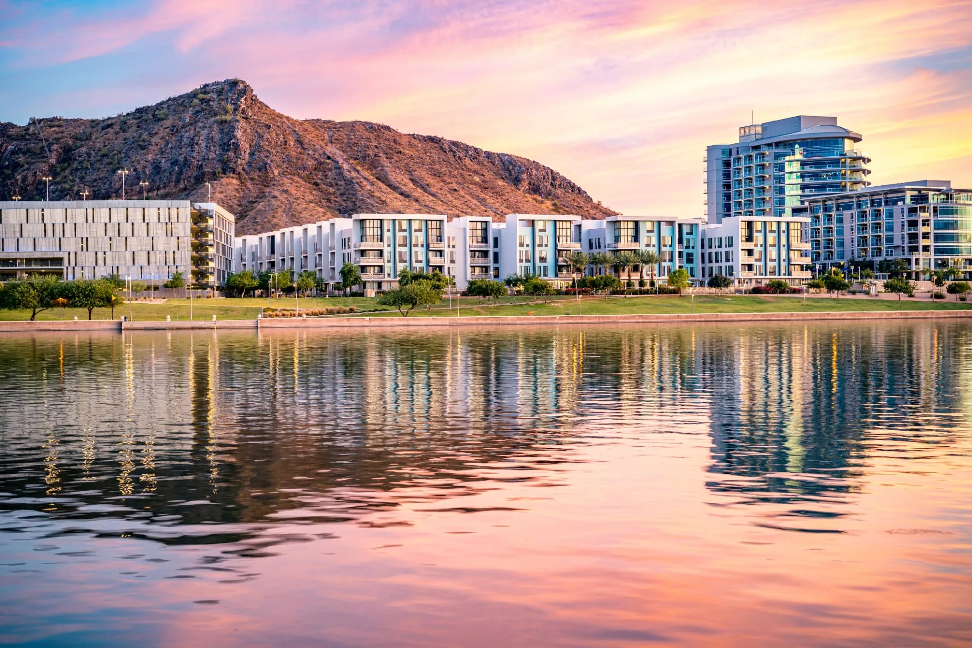 Tempe Town Lake waterfront buildings at sunset with Hayden Butte behind, rope access, confined space rescue and safety services in Tempe, AZ