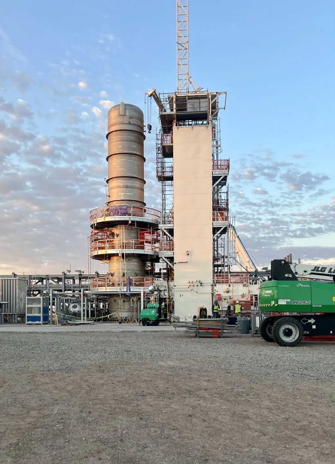 Tall industrial stack and process structure at a power generation facility