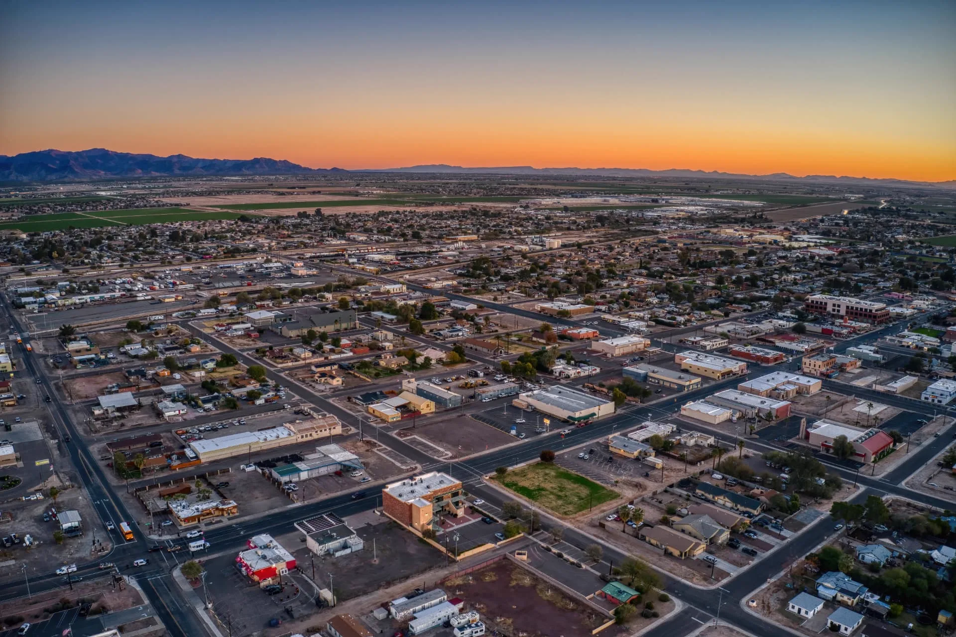 Wide aerial view of Buckeye at dusk with mountains on the horizon, rope access, confined space rescue and safety services in Buckeye, AZ