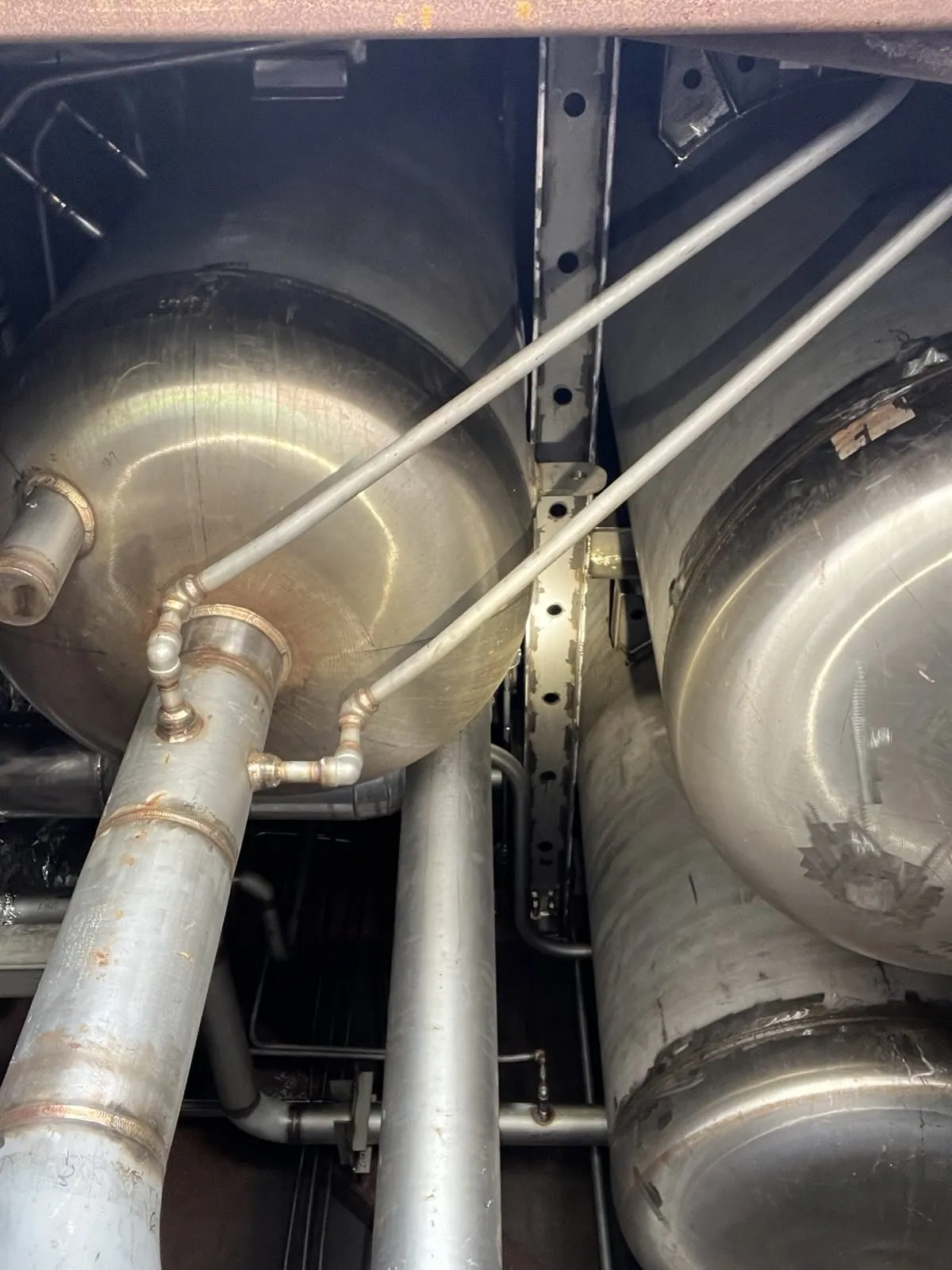 Large industrial vessels and connected pipework viewed from an elevated position