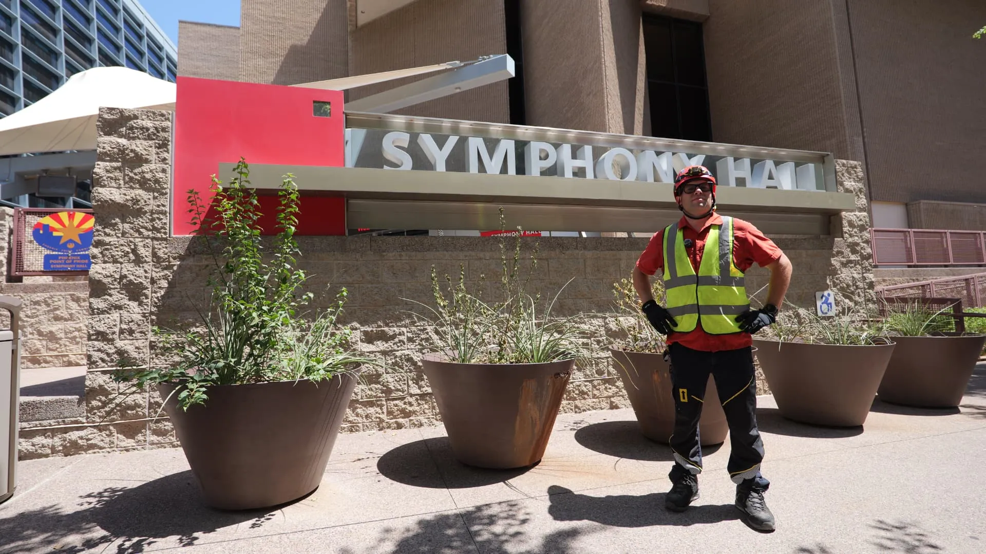 ARS rope access technician in helmet and high-visibility vest outside a downtown Phoenix venue
