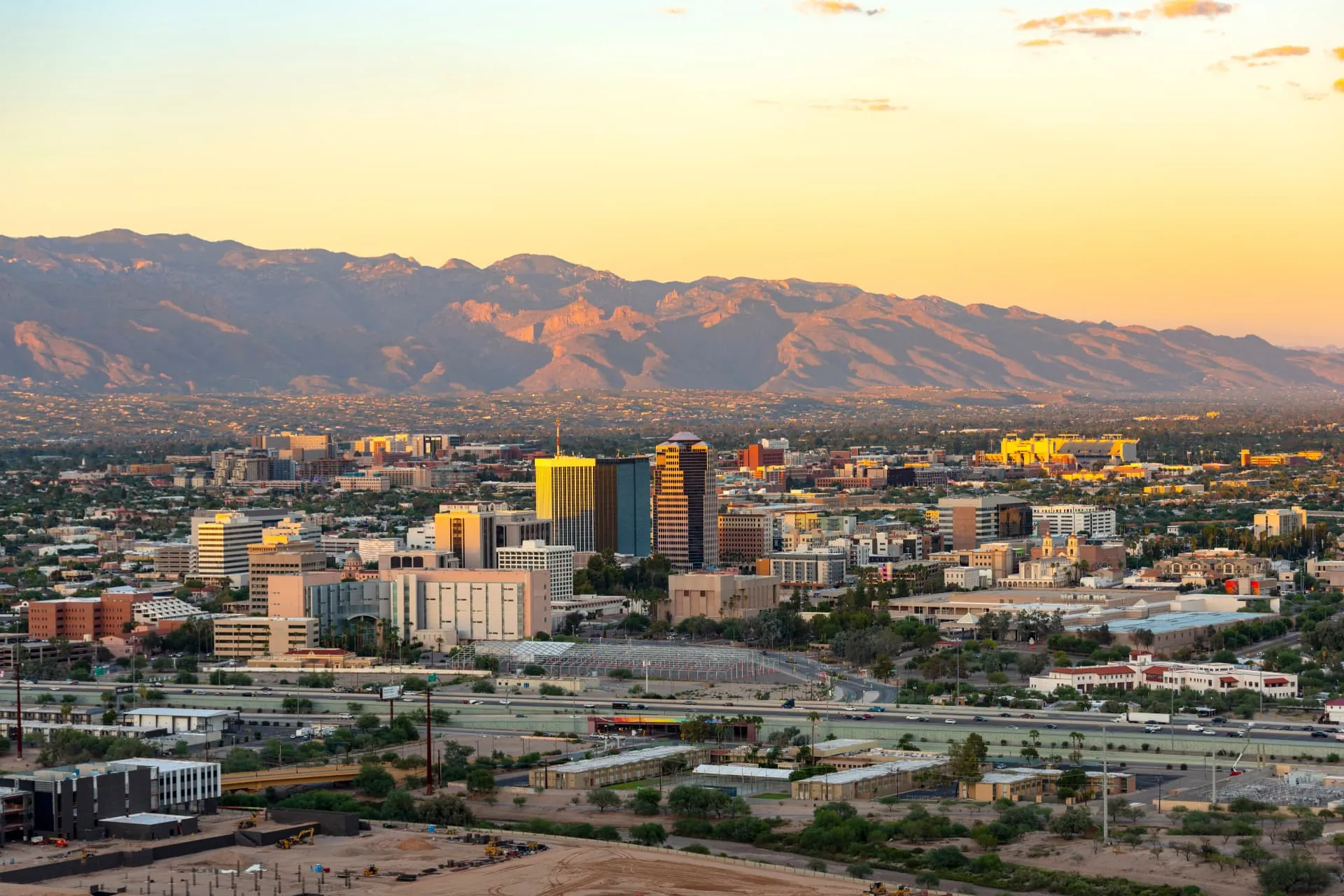 Tucson skyline and industrial corridor beneath the Santa Catalina Mountains, rope access, confined space rescue and safety services in Tucson, AZ