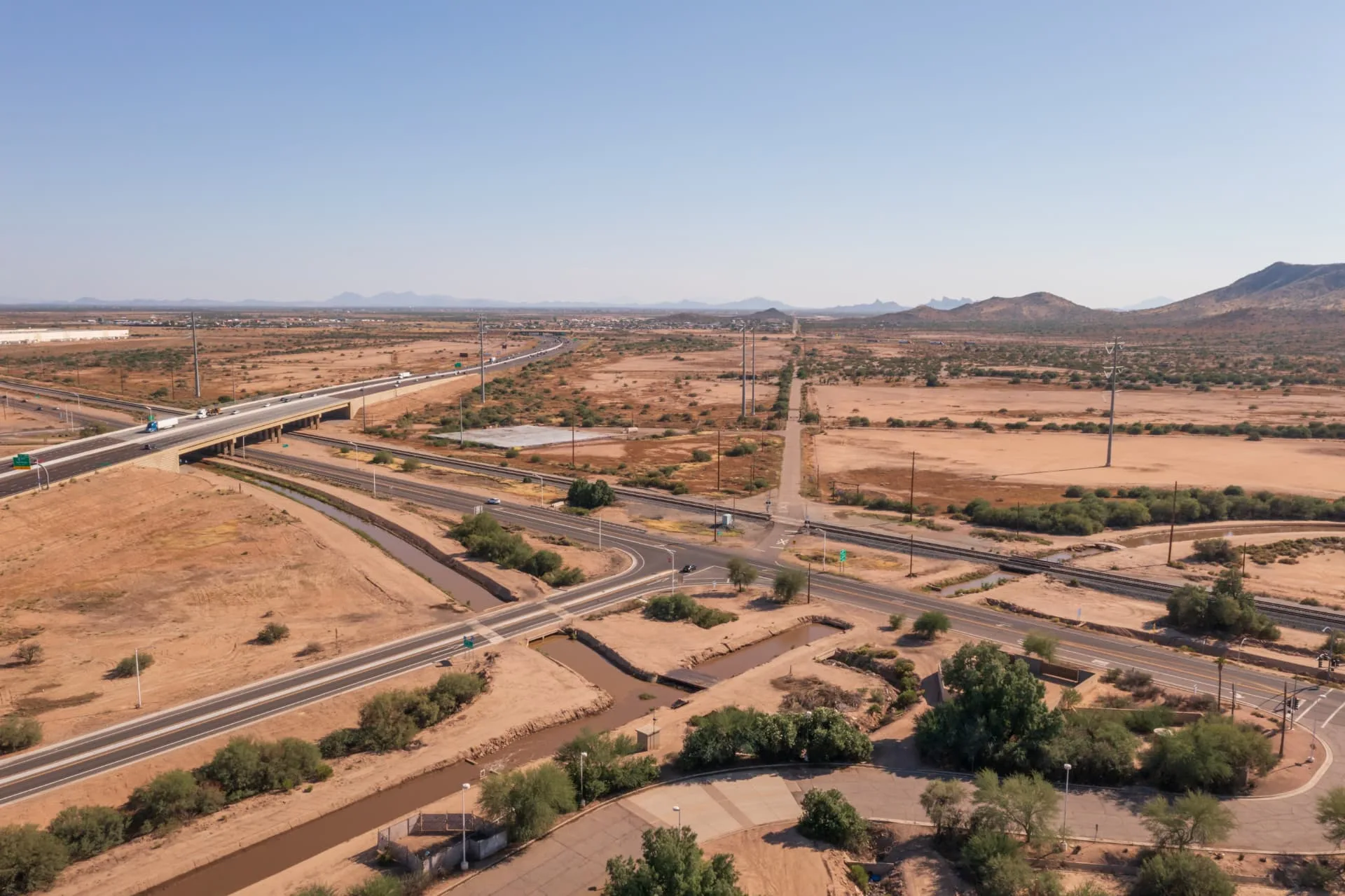 Aerial view of the Casa Grande interstate, rail, and canal infrastructure corridor, rope access, confined space rescue and safety services in Casa Grande, AZ