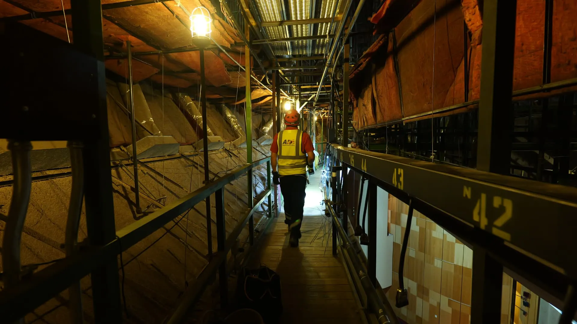ARS technicians working along an interstitial building walkway