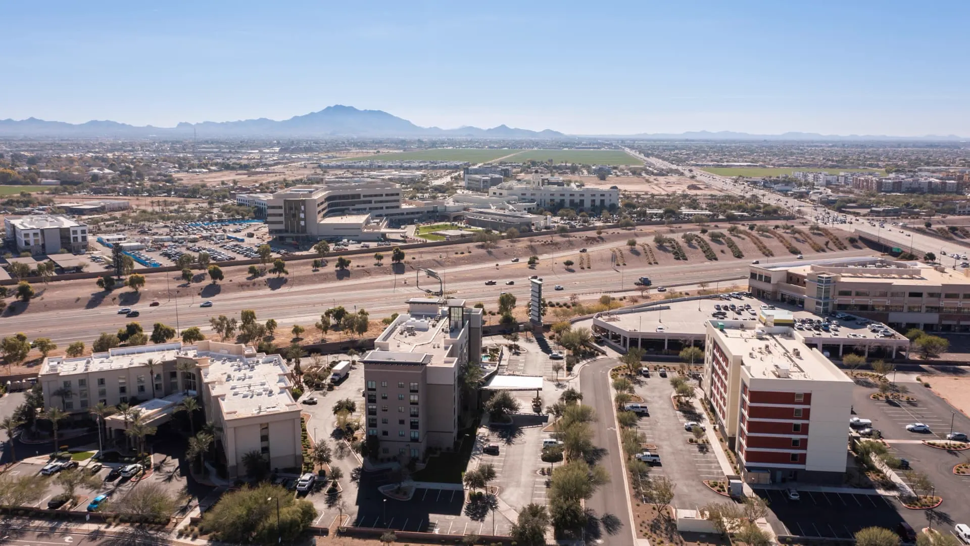 Aerial view of the Gilbert medical and commercial corridor along the freeway, rope access, confined space rescue and safety services in Gilbert, AZ