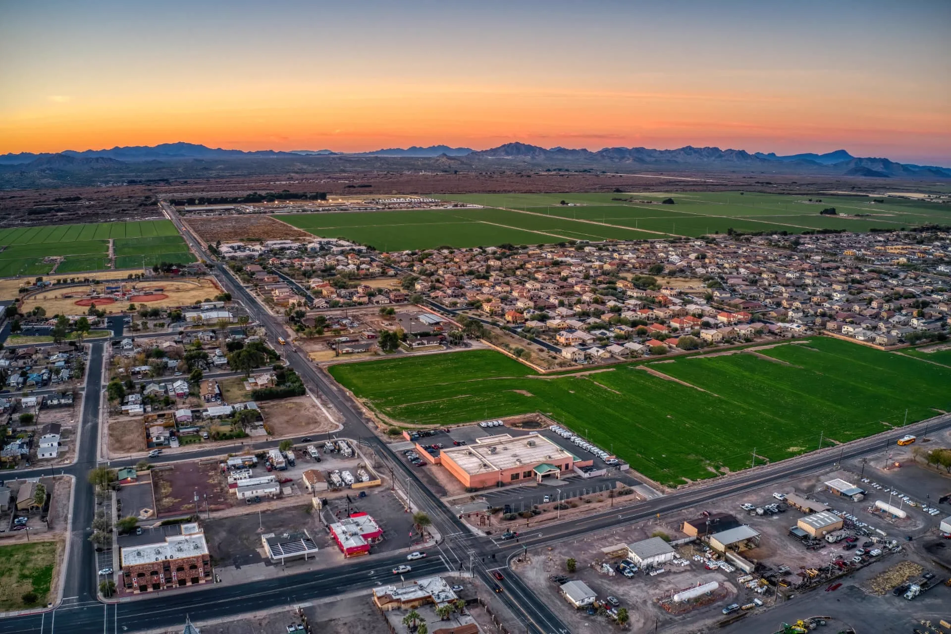 Aerial view of Buckeye neighborhoods bordered by farmland and desert, rope access, confined space rescue and safety services in Buckeye, AZ