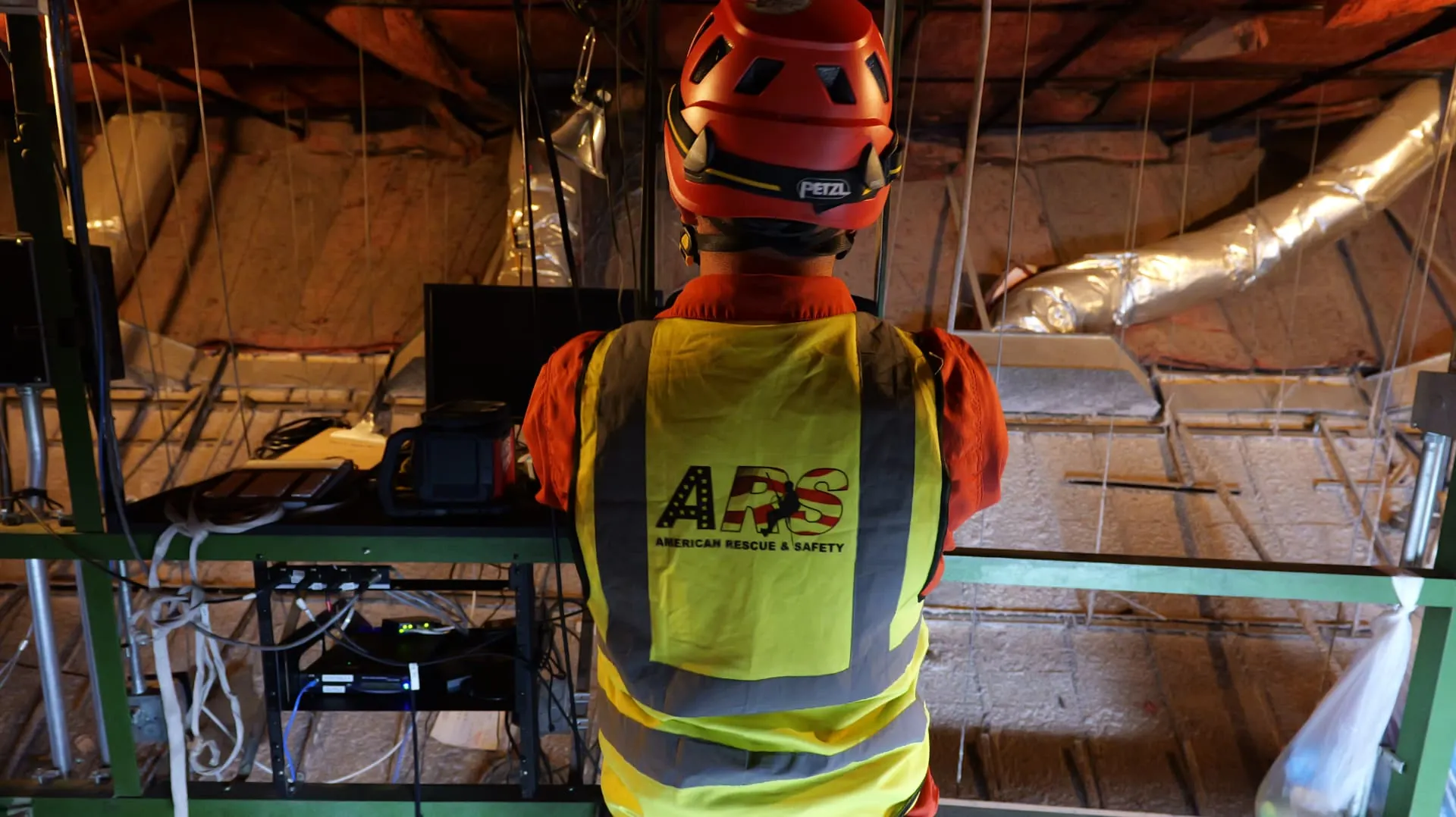 ARS safety personnel monitoring an active entry from a site monitoring and attendant station