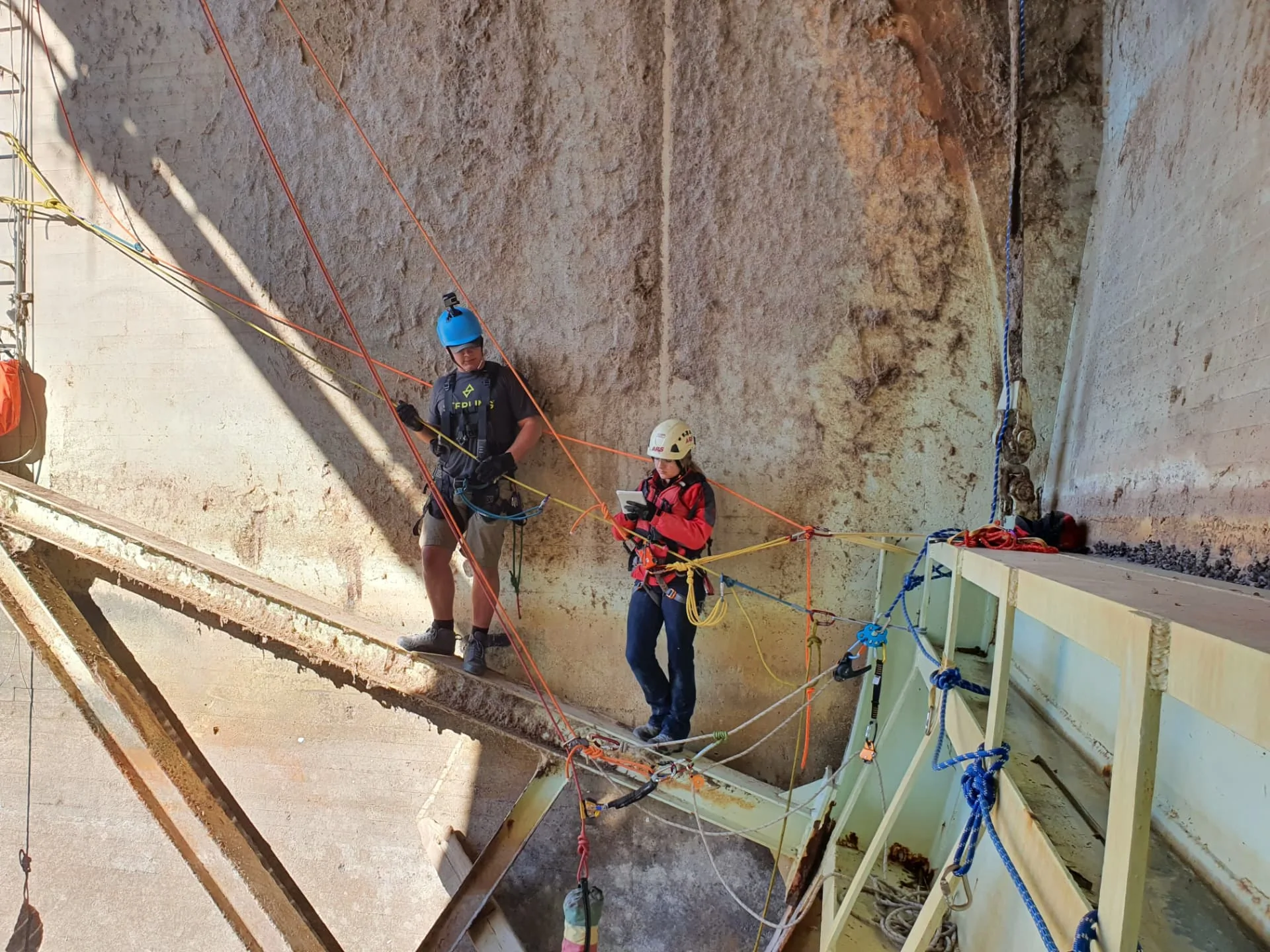 Looking down into an industrial shaft where restricted access complicates rescue