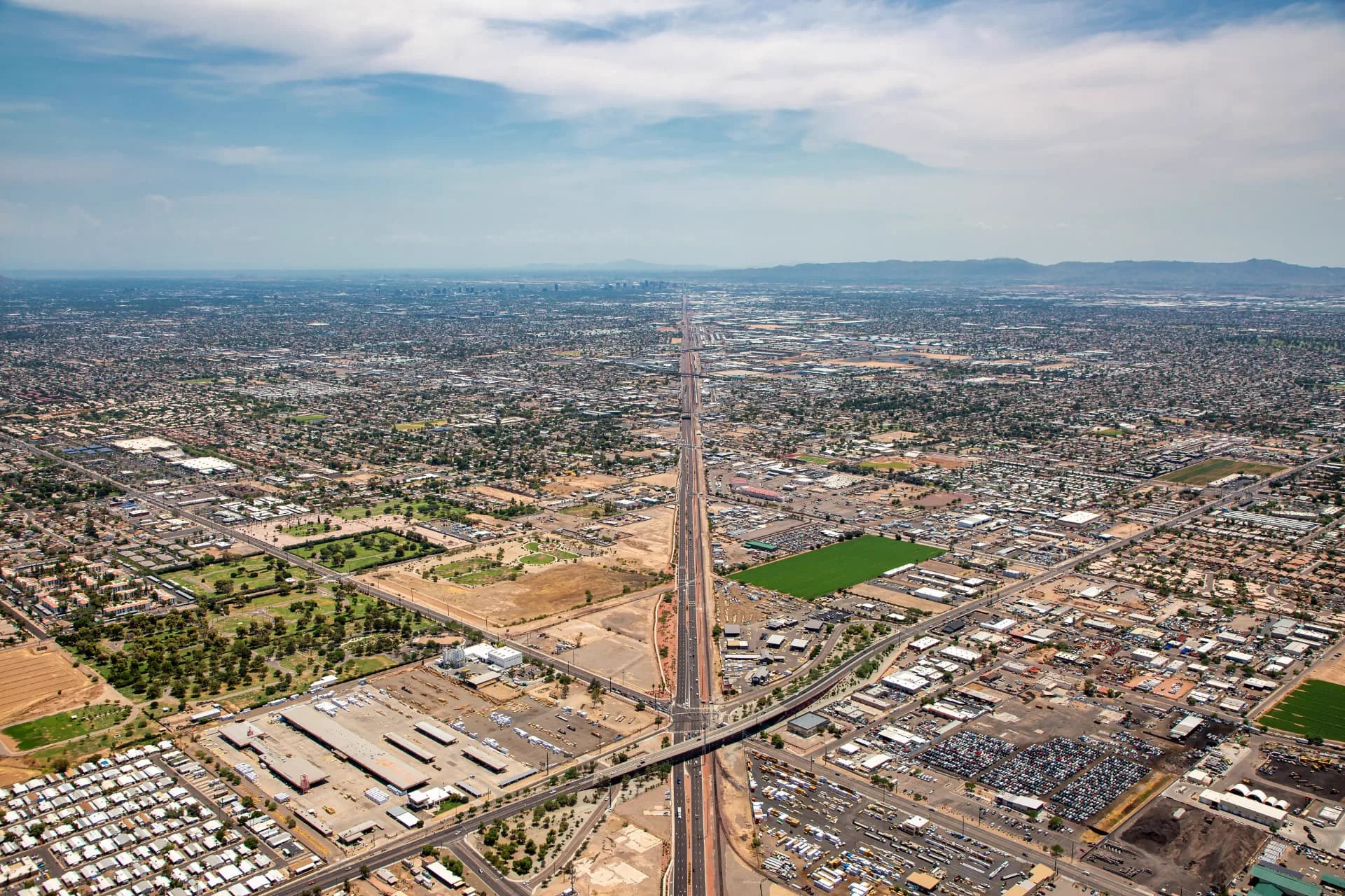 Wide aerial view of a Glendale freeway and industrial corridor, rope access, confined space rescue and safety services in Glendale, AZ