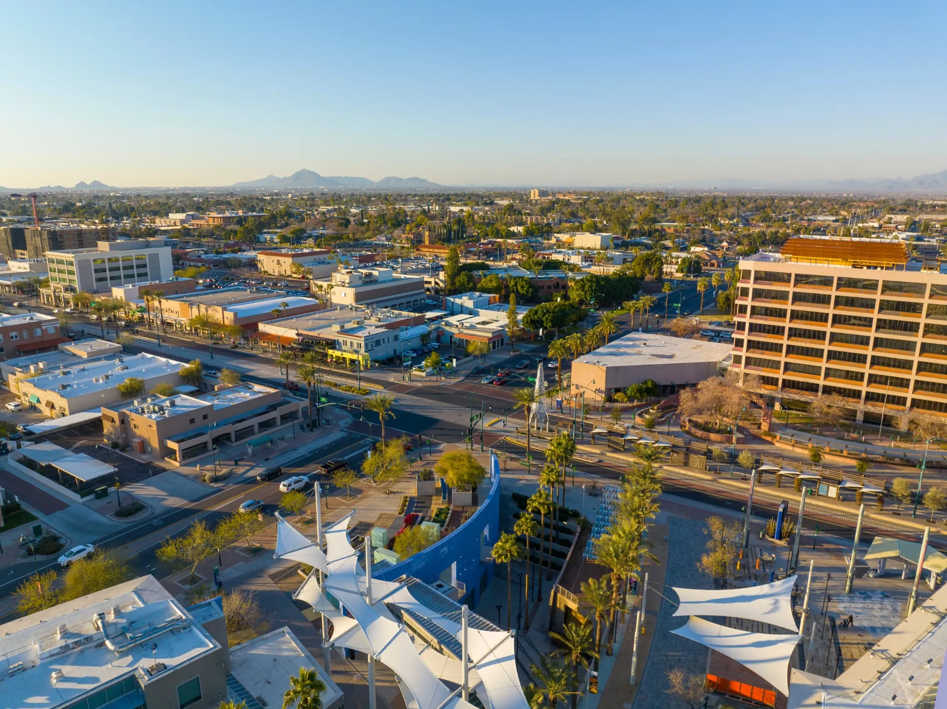 Aerial view of downtown Mesa at golden hour with the light rail corridor