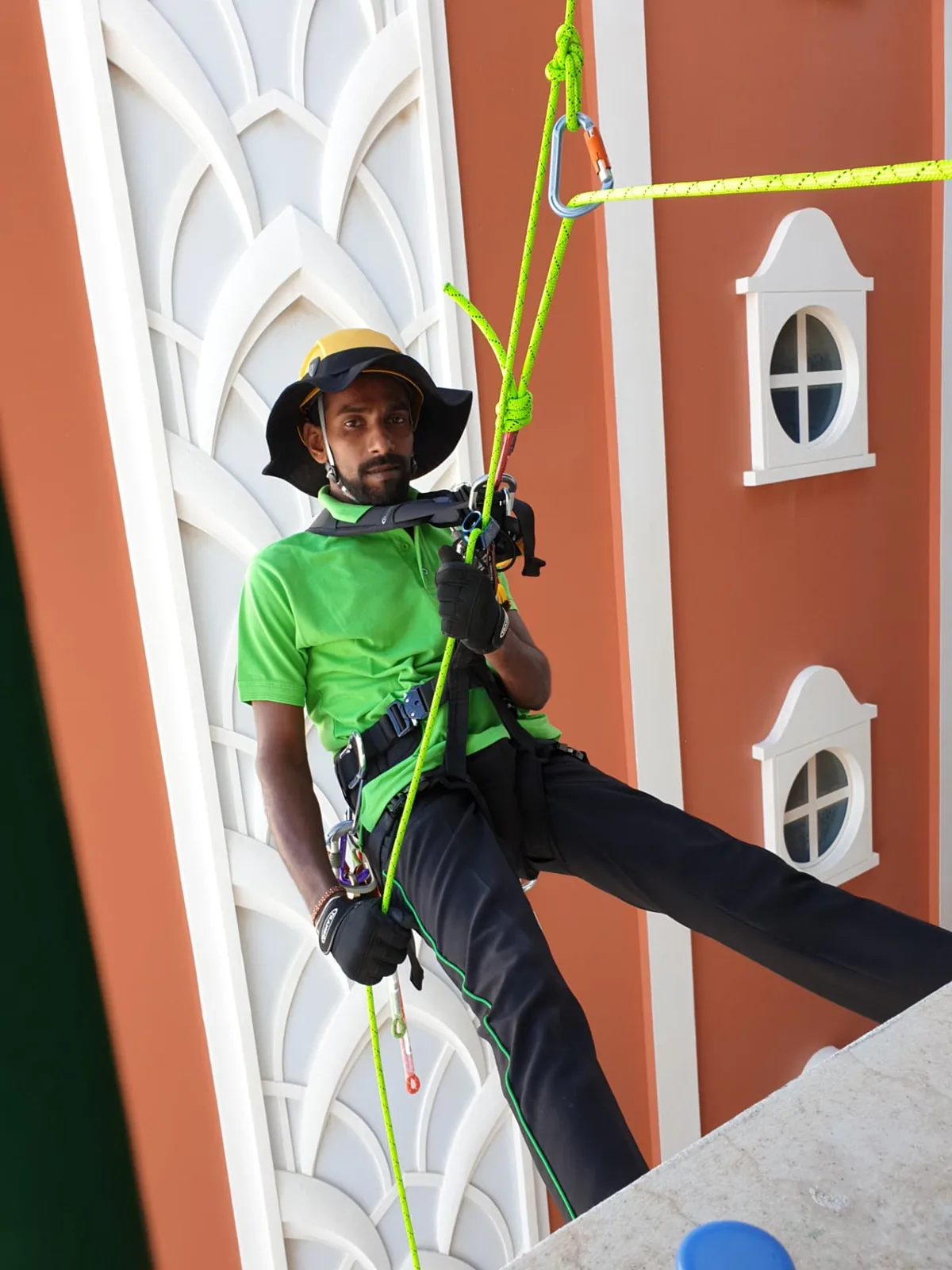 ARS rope access technician working on a building facade