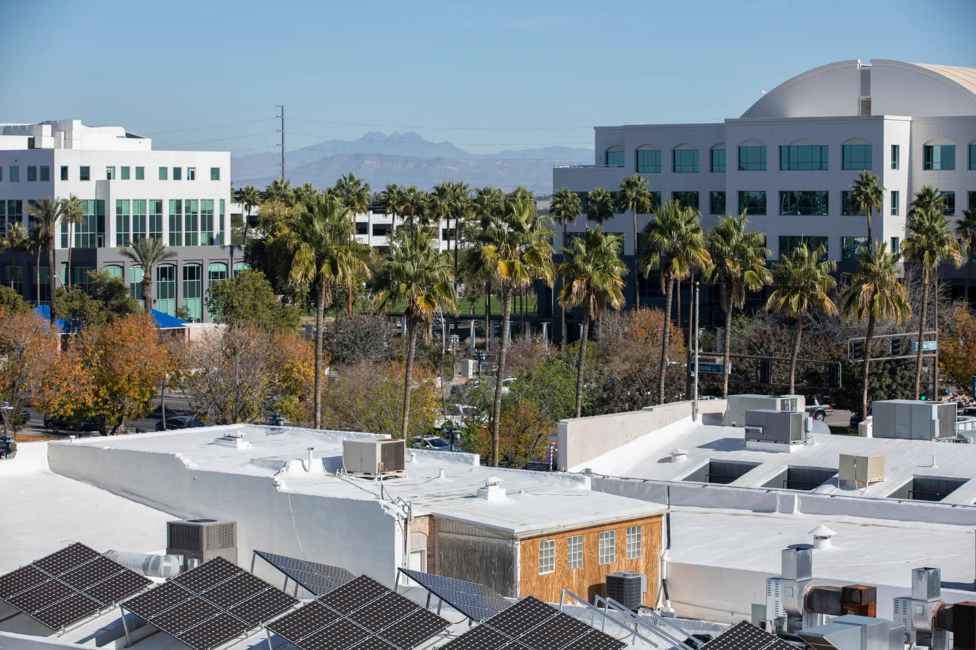 Chandler rooftop mechanical equipment with downtown buildings and mountains behind