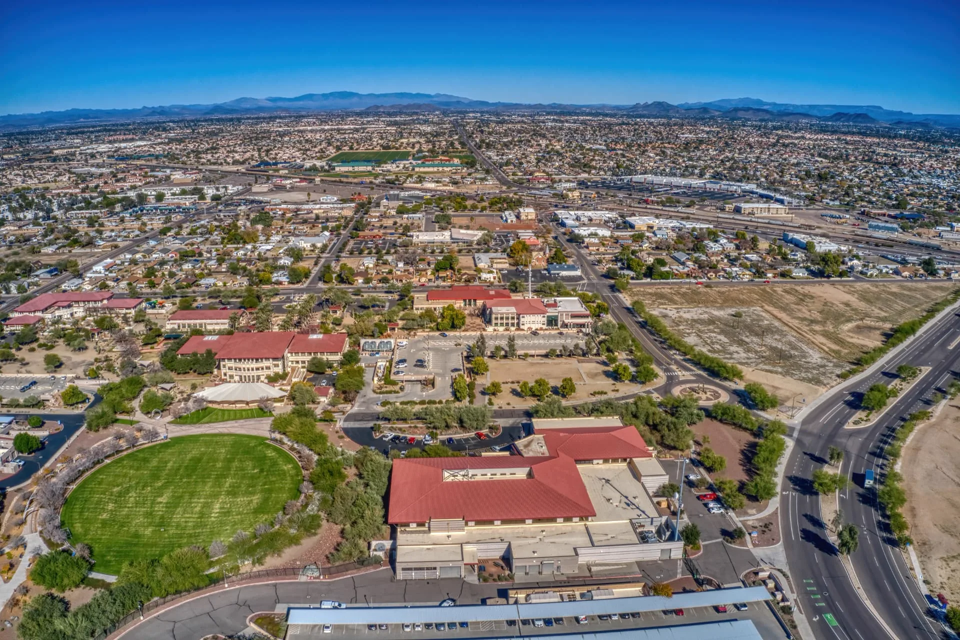 Aerial view of the Peoria, Arizona civic district with the valley and mountains beyond